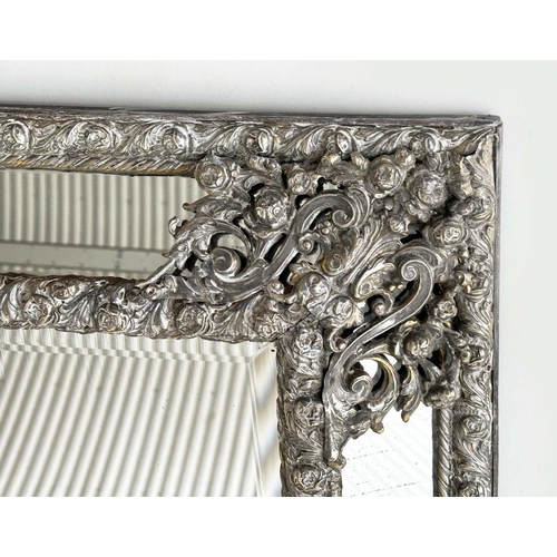 316 - DUTCH WALL MIRROR, 19th century Dutch repoussé silvered metal cushion frame, marginal plates and cre... 