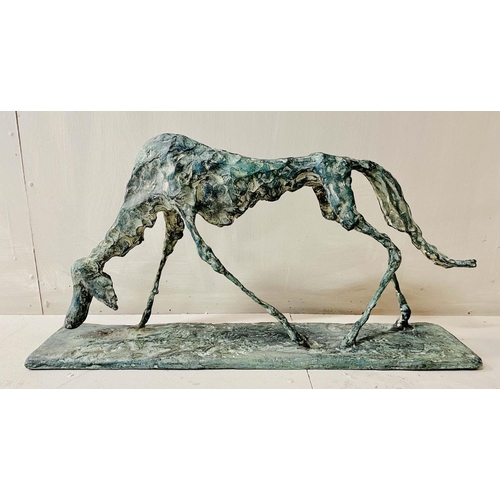 327 - FIGURE OF A DOG, bronze abstract form in a standing position, 30cm H x 60cm L x 13cm D.