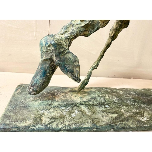 327 - FIGURE OF A DOG, bronze abstract form in a standing position, 30cm H x 60cm L x 13cm D.