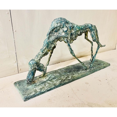 327 - FIGURE OF A DOG, bronze abstract form in a standing position, 30cm H x 60cm L x 13cm D.