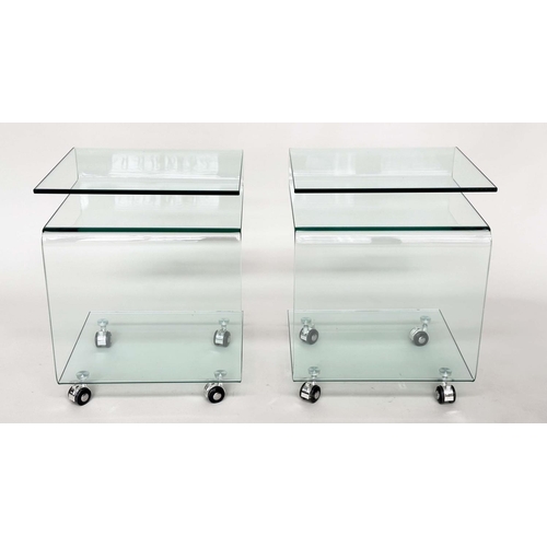 387 - CALLIGARIS OCCASIONAL TABLES, a pair, glass shaped each with shelf, under tier and castors, 42cm x 3... 