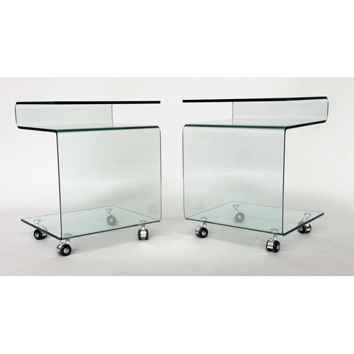 387 - CALLIGARIS OCCASIONAL TABLES, a pair, glass shaped each with shelf, under tier and castors, 42cm x 3... 