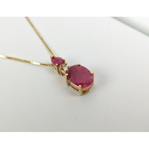 39 - A 14CT GOLD RUBY AND DIAMOND PENDANT NECKLACE, the mixed cut rubies with a round brilliant cut diamo... 