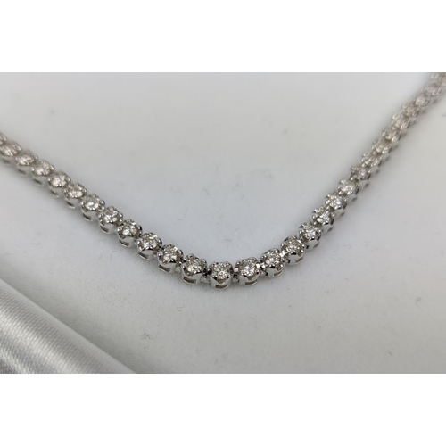 43 - AN 18CT WHITE GOLD DIAMOND SET NECKLACE, set with approximately 140 round brilliant cut diamonds, to... 