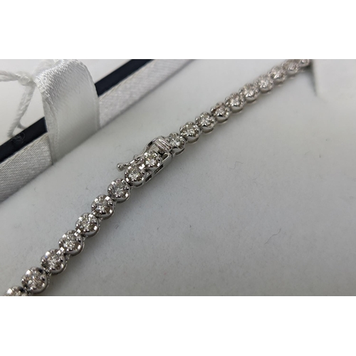 43 - AN 18CT WHITE GOLD DIAMOND SET NECKLACE, set with approximately 140 round brilliant cut diamonds, to... 