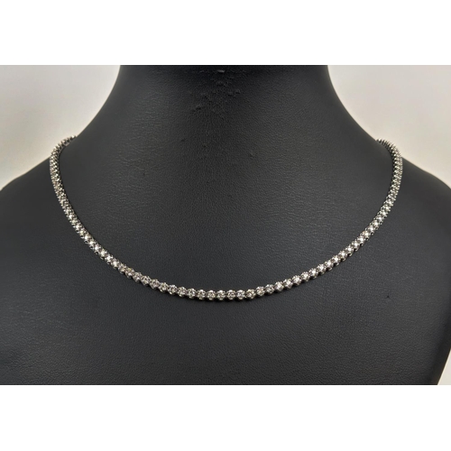 43 - AN 18CT WHITE GOLD DIAMOND SET NECKLACE, set with approximately 140 round brilliant cut diamonds, to... 