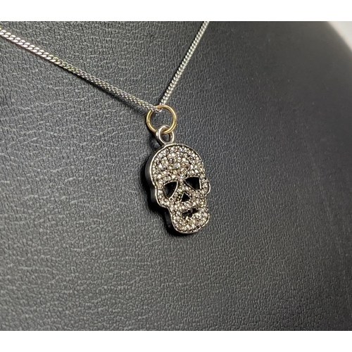 45 - A SILVER AND DIAMOND SET SKULL PENDANT, Italian silver chain, 46cm long, complete with box.