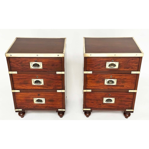 539 - CAMPAIGN CHESTS, a pair, mahogany and brass bound each with three drawers and turned supports, 44cm ... 