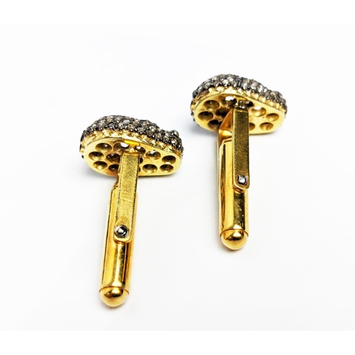 57 - A PAIR OF SILVER-GILT MEMENTO MORI-STYLE SKULL CUFFLINKS, with pave set rose cut diamonds, approxima... 