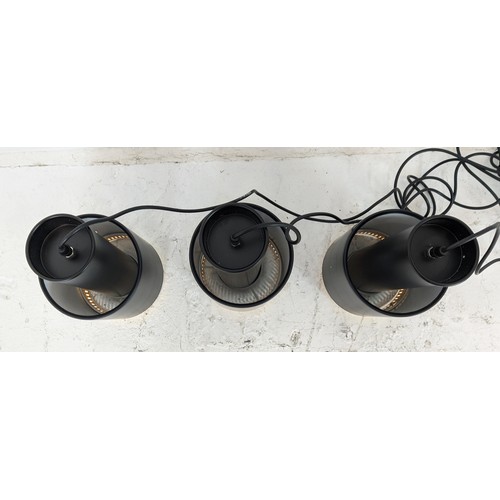 332 - PENDANT LIGHTS, a set of three, 1970s Italian style, black painted metal with gilt detail, 45.5cm dr... 