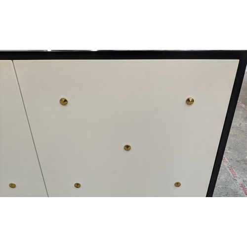 329 - SIDEBOARD, 210cm x 50cm x 81cm approx, black lacquered with white lacquered doors, gilt metal stud d... 