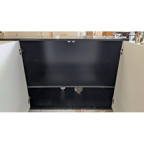 329 - SIDEBOARD, 210cm x 50cm x 81cm approx, black lacquered with white lacquered doors, gilt metal stud d... 