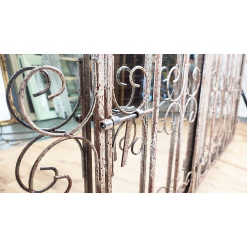 339 - GARDEN WALL MIRRORS, a pair, gated design with distressed metal frames, 90cm H x 70cm W. (2)