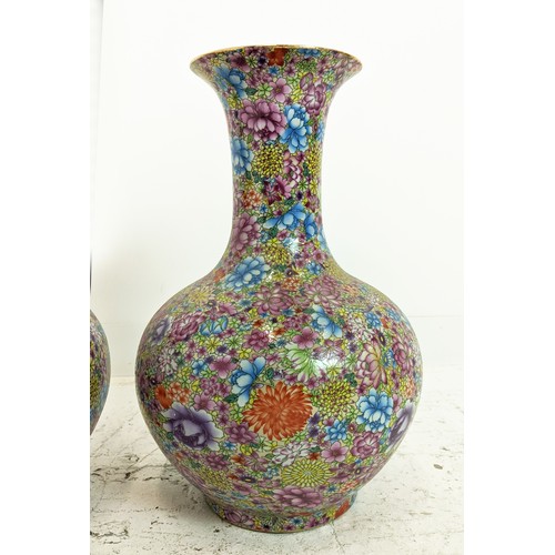 337 - VASES, a pair, floral decorated ceramic, 55cm H x 40cm W. (20