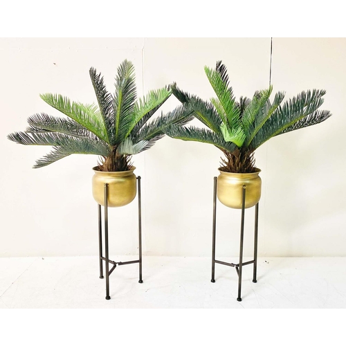 359 - FAUX FERN TREES, in gilt metal planters, 115cm x 75cm x 75cm.