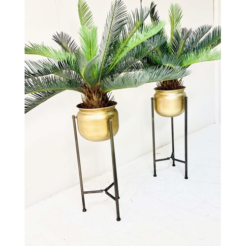 359 - FAUX FERN TREES, in gilt metal planters, 115cm x 75cm x 75cm.