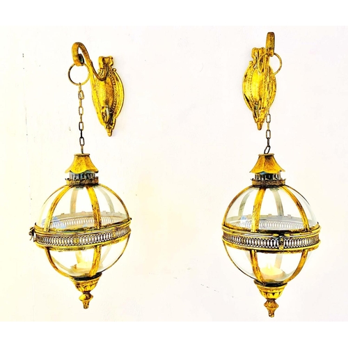 349 - WALL HANGING GLOBE CANDLE LANTERNS, a pair, Regency style gilt metal, 80cm H x 25cm. (2)