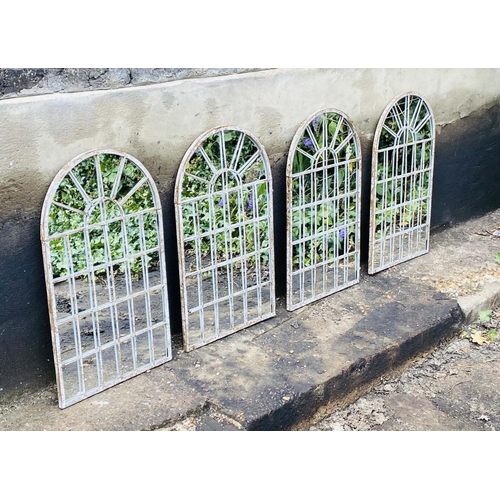 348 - ARCHITECTURAL GARDEN WALL MIRRORS, a set of four, distressed metal arched frames, 60cm H x 36cm. (4)