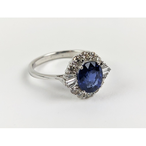 41 - AN 18CT WHITE GOLD SAPPHIRE AND DIAMOND HALO RING, the central oval mixed cut sapphire of approximat... 