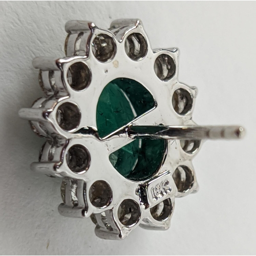 43 - A PAIR OF 18CT WHITE GOLD EMERALD AND DIAMOND CLUSTER STUD EARRINGS, the oval mixed cut emerald ston... 