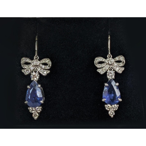 46 - A PAIR OF 18CT WHITE GOLD SAPPHIRE AND DIAMOND PENDANT EARRINGS, central pear shaped faceted sapphir... 