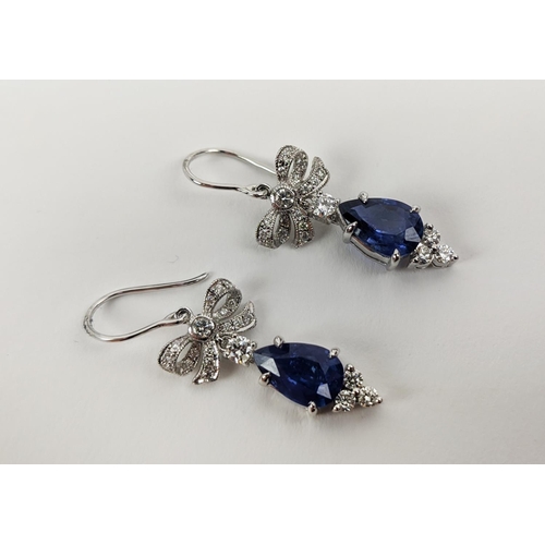 46 - A PAIR OF 18CT WHITE GOLD SAPPHIRE AND DIAMOND PENDANT EARRINGS, central pear shaped faceted sapphir... 