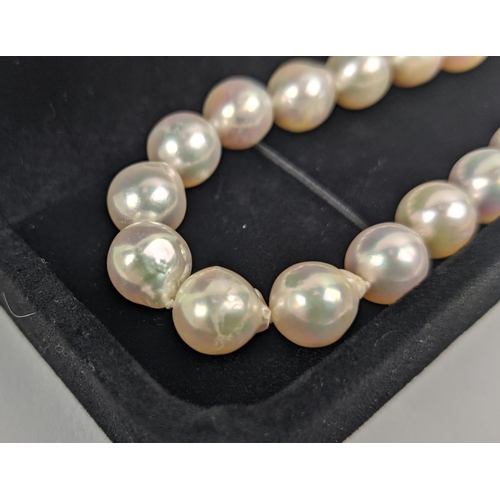 49 - CULTURED PEARL SINGLE STRAND NECKLACE, each pearl of round irregular form, 8mm diam approx, 14ct gol... 