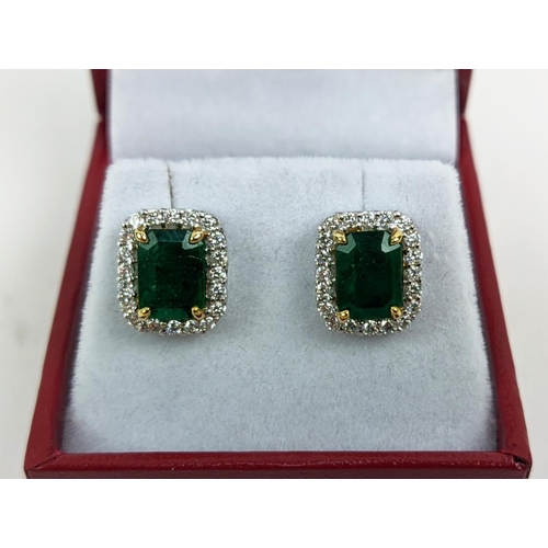 39 - A PAIR OF 18CT WHITE GOLD EMERALD AND DIAMOND STUD EARRINGS, step cut emeralds of approximately 3.23... 