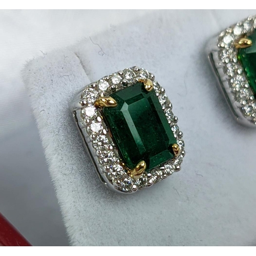 39 - A PAIR OF 18CT WHITE GOLD EMERALD AND DIAMOND STUD EARRINGS, step cut emeralds of approximately 3.23... 