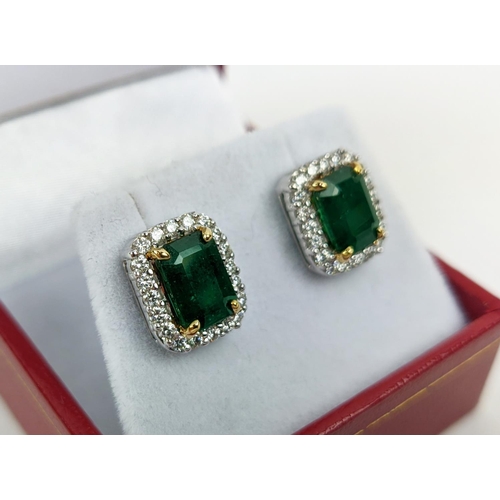 39 - A PAIR OF 18CT WHITE GOLD EMERALD AND DIAMOND STUD EARRINGS, step cut emeralds of approximately 3.23... 