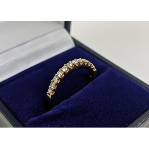 53 - AN 18CT GOLD DIAMOND HALF ETERNITY RING, set with twelve round brilliant cut diamonds, ring size M, ... 