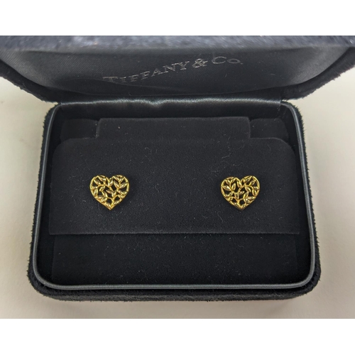 54 - A PAIR OF TIFFANY 18CT GOLD STUD EARRINGS, in the form of hearts with pierced foliage design, comple... 