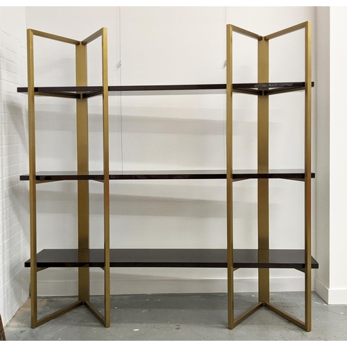 308 - BOOKCASE, two gilt metal supports holding three veneered shelves, 200cm x 50cm x 208.5cm approx.