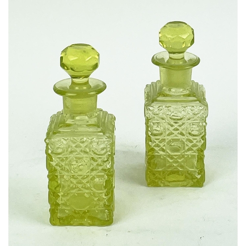 12 - QUANTITY OF URANIUM GLASS, various items including pairs of candlesticks, jugs, lidded vases, bottle... 