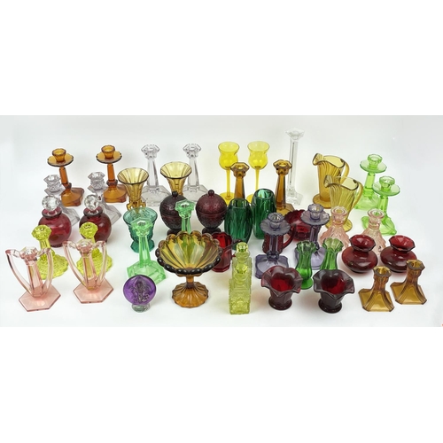 12 - QUANTITY OF URANIUM GLASS, various items including pairs of candlesticks, jugs, lidded vases, bottle... 