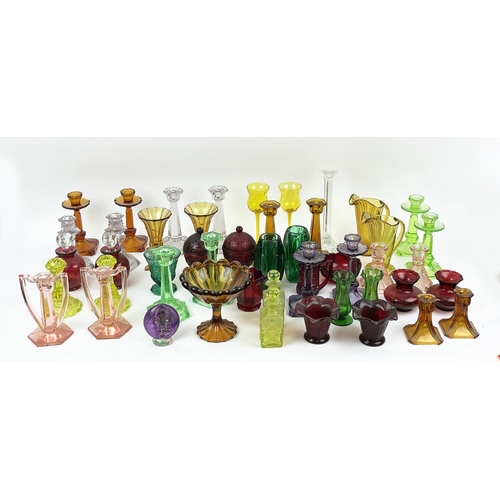 12 - QUANTITY OF URANIUM GLASS, various items including pairs of candlesticks, jugs, lidded vases, bottle... 