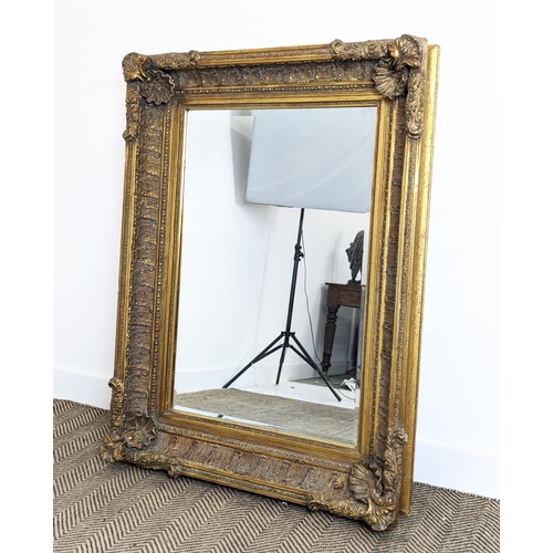 212 - WALL MIRROR, 19th century style gilt framed with shell and leaf decoration, 121cm x 88cm.