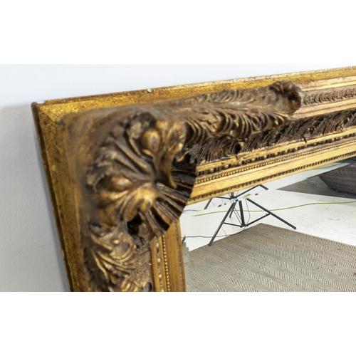 212 - WALL MIRROR, 19th century style gilt framed with shell and leaf decoration, 121cm x 88cm.