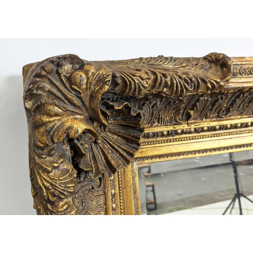 212 - WALL MIRROR, 19th century style gilt framed with shell and leaf decoration, 121cm x 88cm.