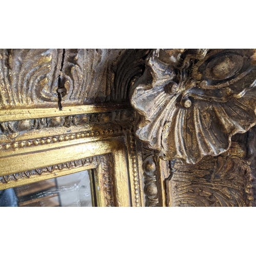 212 - WALL MIRROR, 19th century style gilt framed with shell and leaf decoration, 121cm x 88cm.