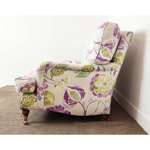 223 - SOFA, purple and green floral patterned on brass castors, 90cm H x 160cm W.