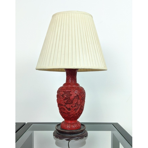 4 - CINNABAR STYLE LACQUER LAMP, early 20th century, carved with a fine claw dragon on a rosewood carved... 