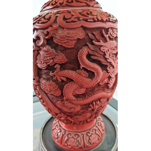 4 - CINNABAR STYLE LACQUER LAMP, early 20th century, carved with a fine claw dragon on a rosewood carved... 