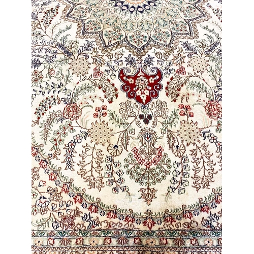 79 - FINE PURE SILK HEREKE DESIGN CARPET, 270cm x 180cm.