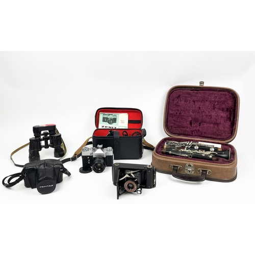 8 - CAMERAS, including a 1930s coronet de luxe red facia, a Pentax Me Super, a Zenit-B cased a Besson of... 