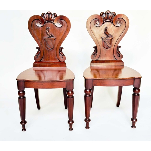 108 - HALL CHAIRS, a pair, George III English Country House mahogany with carved armorial backs and facett... 