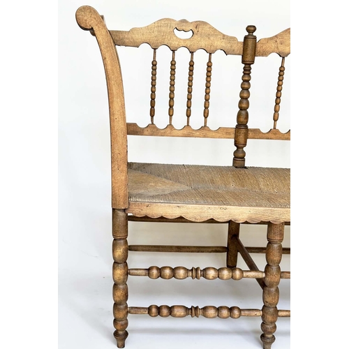 129 - HALL SEAT, 19th century English, William Morris style fruitwood with bobbin turned frame and rush se... 