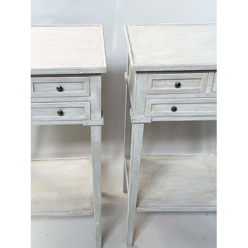 130 - BEDSIDE/LAMP TABLES, a pair, French style grey painted each with three drawers and undertier, 44cm W... 