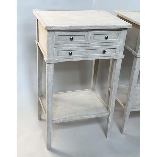 130 - BEDSIDE/LAMP TABLES, a pair, French style grey painted each with three drawers and undertier, 44cm W... 