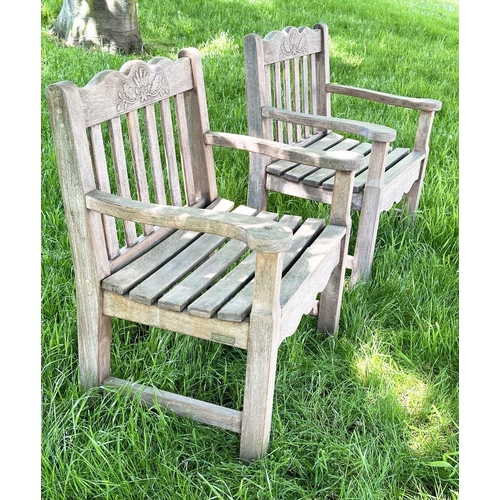 135 - GARDEN ARMCHAIRS BY BRIDGMAN & CO LTD, a pair, well weathered teak with generous seats, slatted back... 